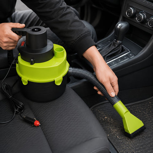 Handheld car vacuum cleaner being used to clean car seat with flexible hose and brush nozzle